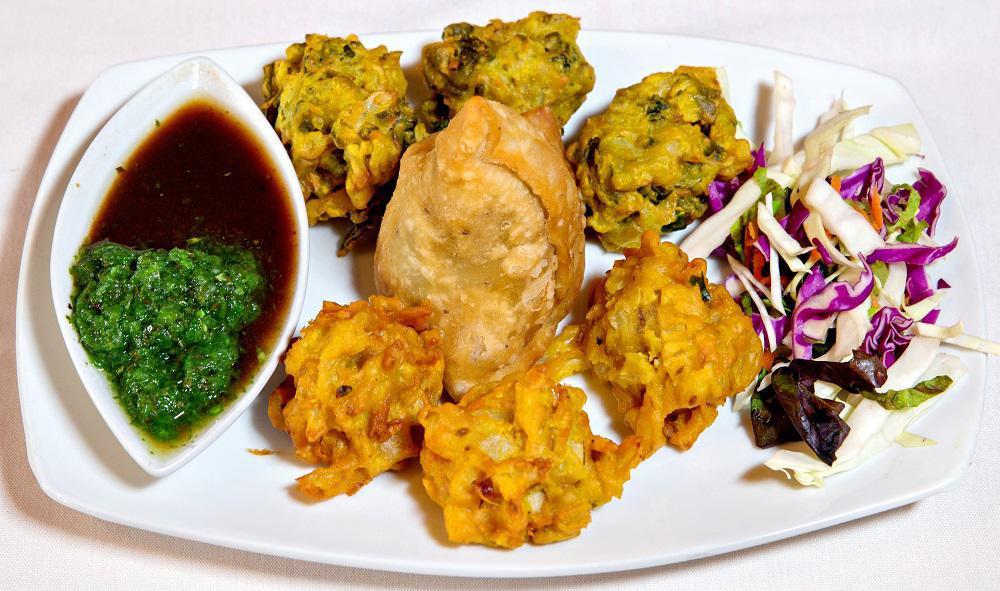 Vegetable Treat (V) · Samosa, onion and spinach fritters.