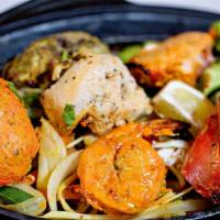 Tandoori Mix Grill · Gluten-free. An assortment of chicken, fish, lamb, and shrimp. Tandoor is a clay oven, marin...