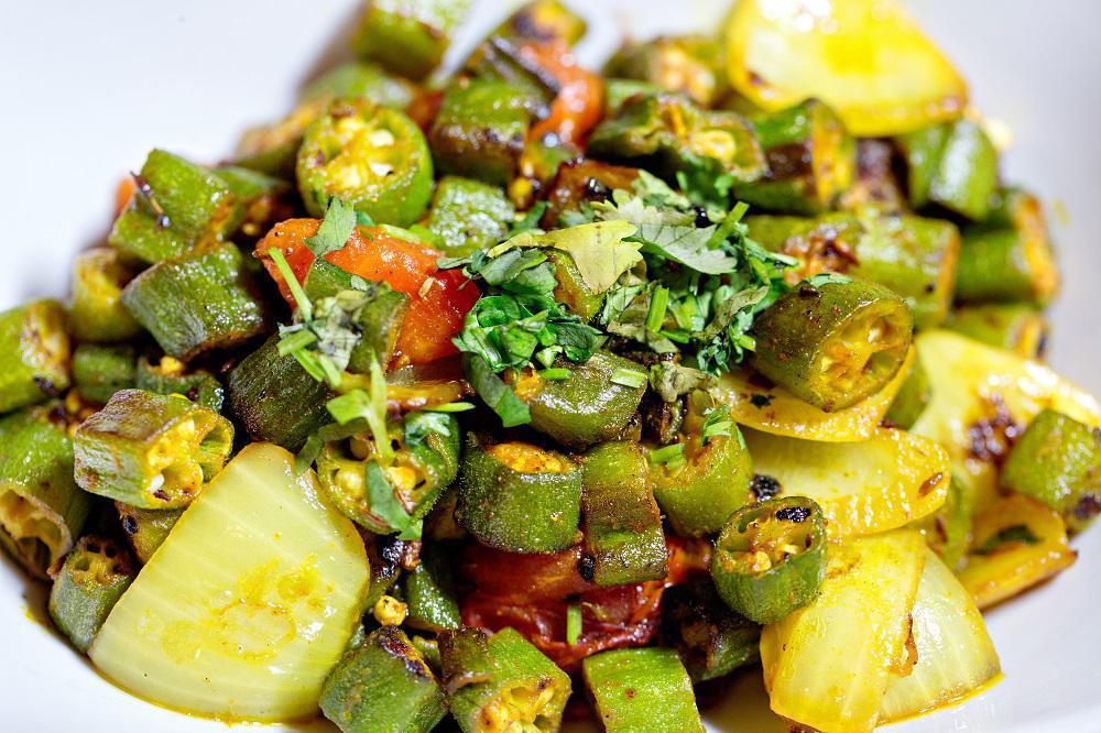Bhindi Masala · Cut okra, peppers, onions, tomatoes, ginger, garlic, fenugreek, herb and masalas.