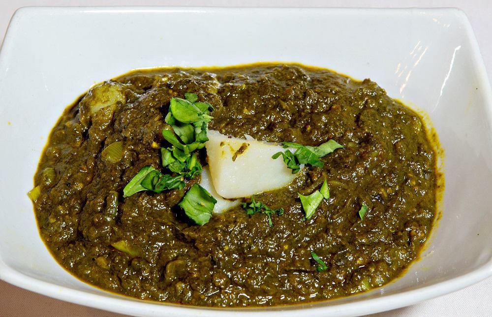 Potato Palak · Spinach, flavorful spices and chickpeas or potatoes.