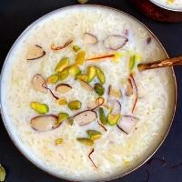 Kheer · Rice pudding made with milk, garnished with raisins, nuts and rose water.