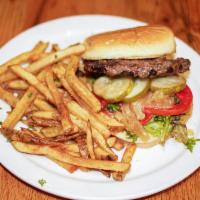 Tangerine Burger · All natural beef burger on a brioche bun with caramelized onions, pickles, fresh tomato and ...