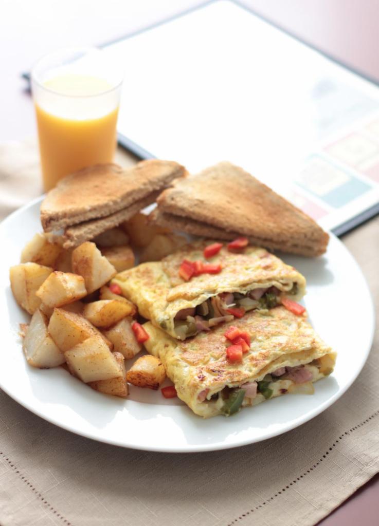 Western with Cheese Omelette · 3 eggs, ham, peppers and onions, topped with American cheese.