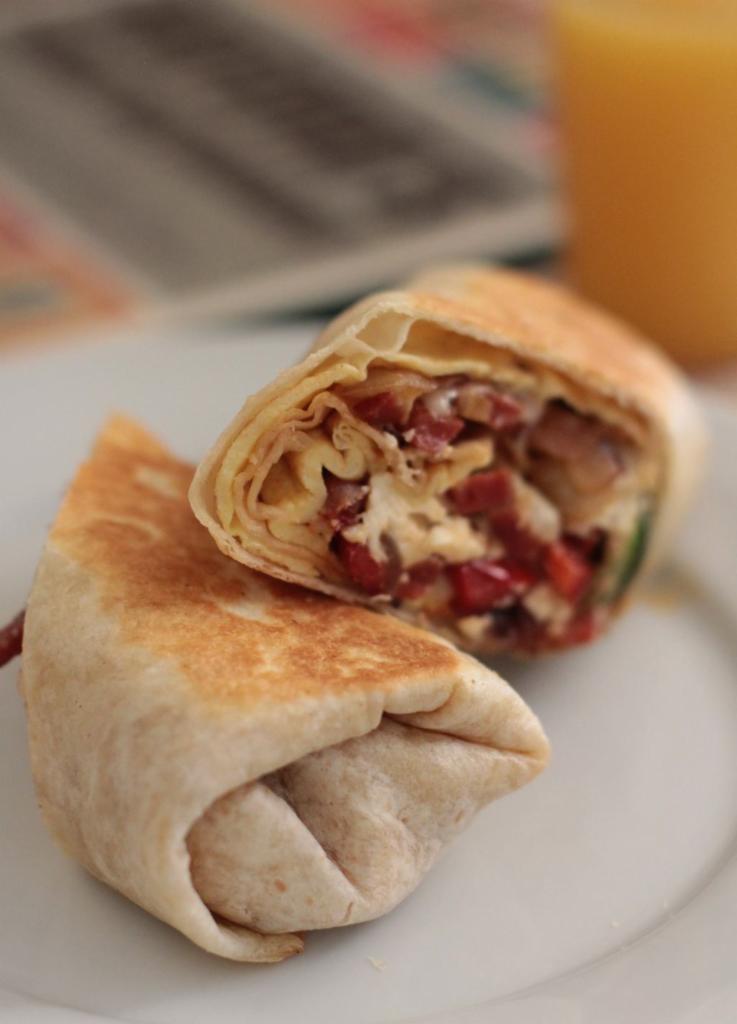 Breakfast Wrap · Scrambled eggs, cheese, choice of ham, sausage, bacon or linguica.