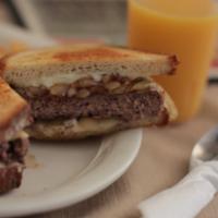 Classic Patty Melt · Includes sauteed onion and cheese on grilled rye bread. Served with french fries.