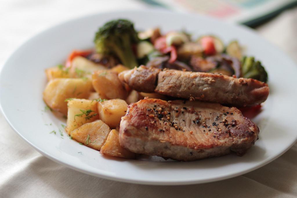 Pork Chops · 2 grilled, juicy and tender boneless pork loin chops, served with mashed or garlicky roasted potatoes and stir-fried vegetables.