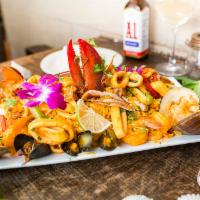 Paella Marinera · For 2. Seafood medley tossed with yellow rice 