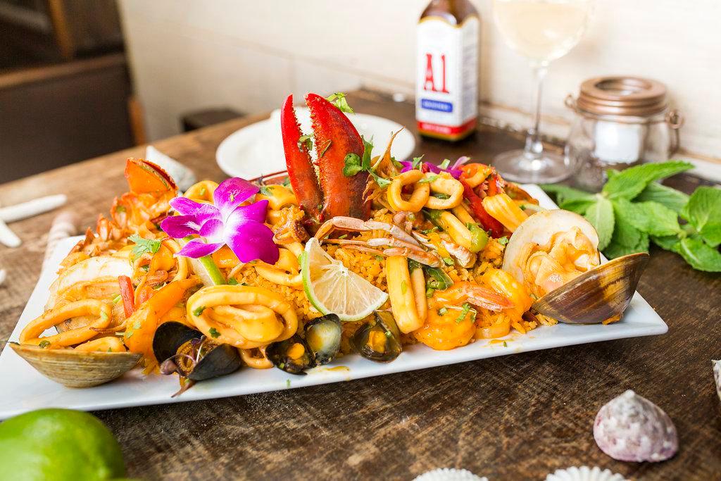 Paella Marinera · For 2. Seafood medley tossed with yellow rice 