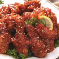 Crispy Yang Nyum Chicken · Crispy fried chicken with sweet and spicy sauce. Served with coleslaw and pickled radish.