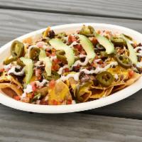 Nachos · Fresh made chips topped with choice of meat, beans, cheese sauce, shredded cheese, fresh sal...