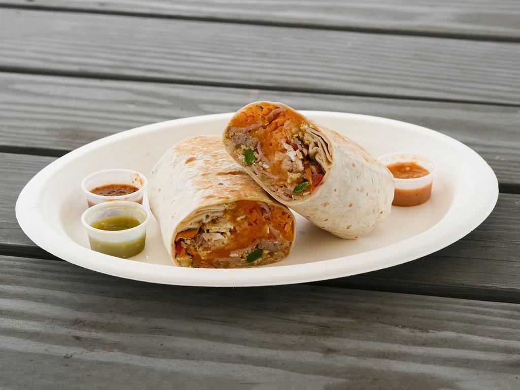 Clasic Breakfast Burrito · Flour tortilla filled with choice of bacon, ham, sausage of chorizo, scrambled egg, hash browns, cheese, and fresh salsa.