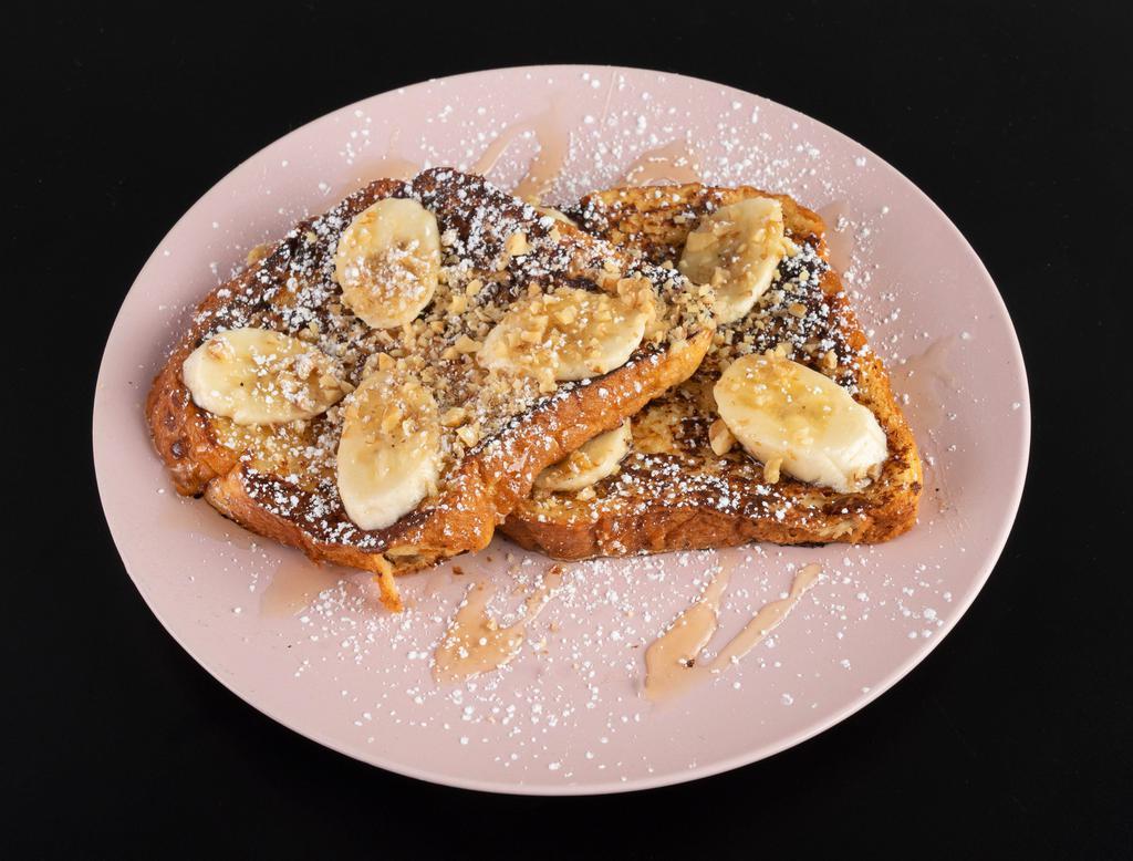 French Toast Honey Banana Breakfast · Fluffy French toast with banana, all natural honey and crushed walnuts.
Nut and vegetarian.