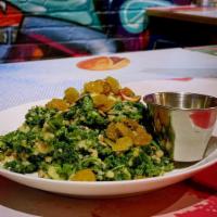 Kale Quinoa Salad · Gluten-free. Kale, quinoa salad, golden raisins, pepitas, sunflower seeds, and house-made ag...
