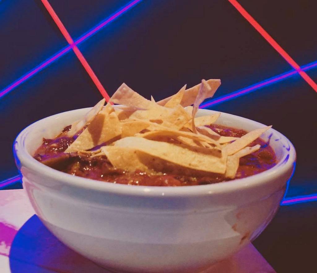 Three Bean Chili  · Gluten-free. Black, kidney and garbanzo beans, corn, beyond patty crumbles, tomato, bell pepper, jalapeno, green chiles, topped with tortilla strips.