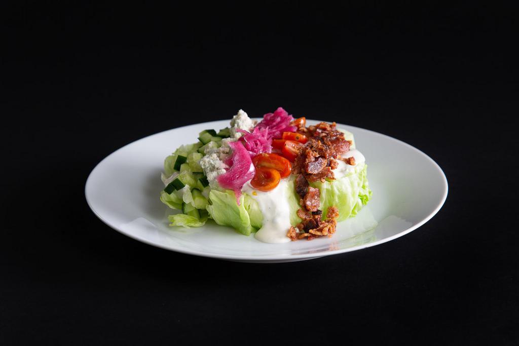 Aioli Wedge Salad · iceberg lettuce // pickled red onion // applewood smoked bacon // tomato // cucumber // blue cheese