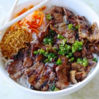 89. Lemongrass Pork Vermicelli · Rice vermicelli with grilled sliced marinated pork, vegetables, and peanut.