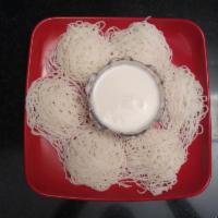 Idiyappam + Coconut Milk · Thin rice noodles steamed and served with coconut milk 