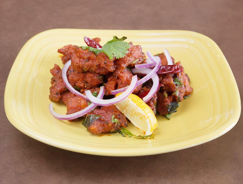 Chicken 65 · Chicken boneless bites, marinated with spices and deep fried.