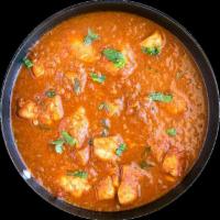 Chicken Vindaloo · Potato and a choice of meat cooked in a tangy and spicy red chili sauce. Choice of side. Non...