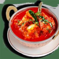 Shrimp Vindaloo · Potato and a choice of meat cooked in a tangy and spicy red chili sauce. Choice of side. Non...