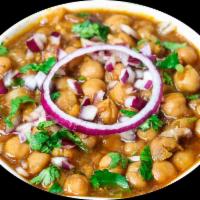 Chana masala · Channa cooked with tomato, onion and spiced curry. Choice of side. Vegan.