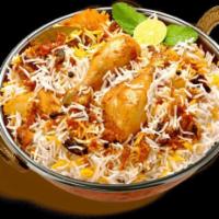 Hyderabadi Chicken Biryani · Chicken marinated and slow cooked with rice layer by layer.