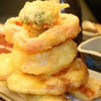 Vegetable Tempura · Lightly battered vegetables with tempura dipping sauce.