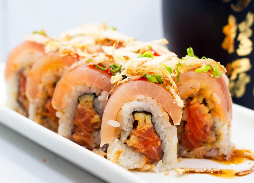 Albacore Roll · Albacore, spicy salmon and cucumber inside with albacore, ponzu sauce, spicy sauce and fried onions on top.