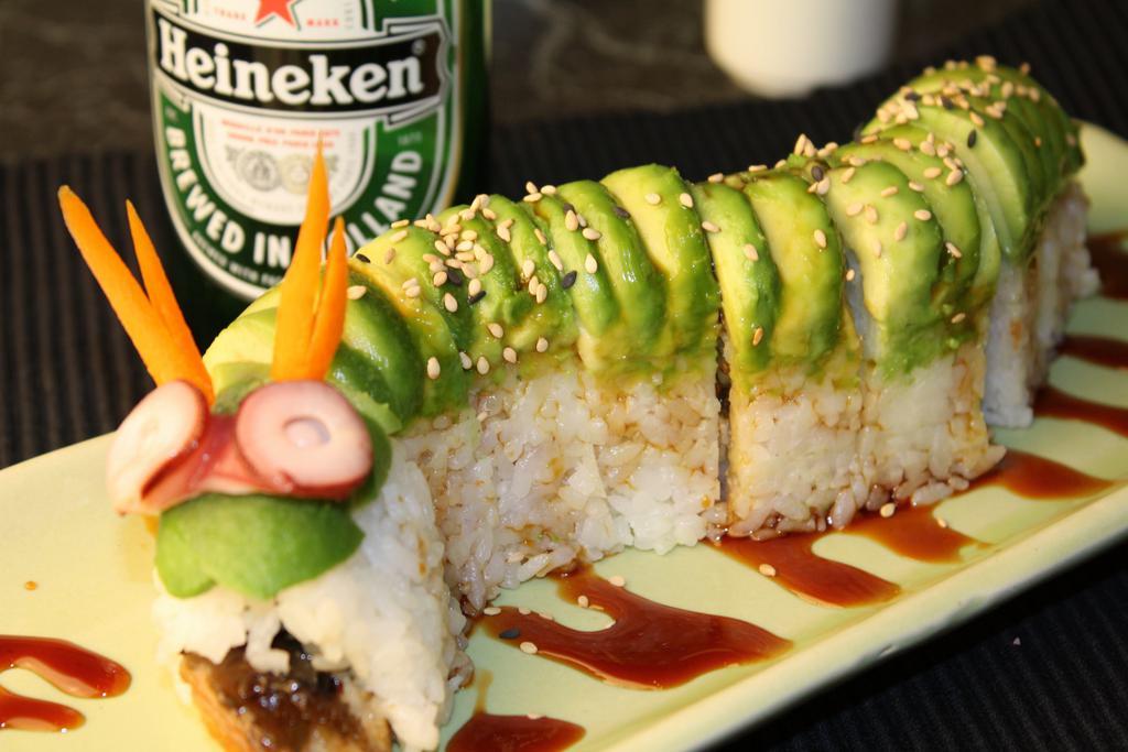 Caterpillar Roll · Eel and cucumber, served with eel sauce and avocado on top.