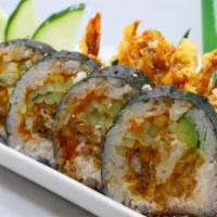 Crazy Spider Roll · Cucumber, avocado, crab, shrimp tempura and soft shell crab inside with eel sauce on top.