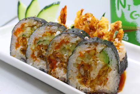 Crazy Spider Roll · Cucumber, avocado, crab, shrimp tempura and soft shell crab inside with eel sauce on top.