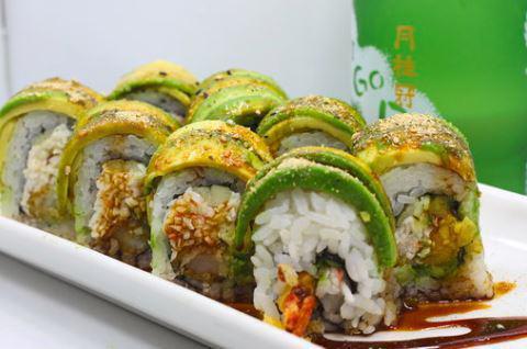 Green Dragon Roll · 2 shrimp tempura, cucumber, avocado and crab inside with avocado, eel sauce and Salmon crunch on top.