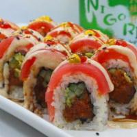 Red Robin Roll · Spicy tuna and cucumber inside with tuna, mustard, cream sauce and eel sauce on top.
