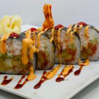 Rock Star Roll · Green chili tempura, shrimp tempura, cucumber, avocado, crab and spicy tuna inside with spic...