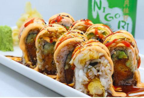 Crying Tiger Roll · Shrimp tempura, spicy tuna cucumber, avocado and shrimp on top with eel sauce or mayo.