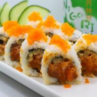 Spicy Salmon Roll · Salmon ,spicy mayo,hot sauce,cucumber and fish eggs on top.