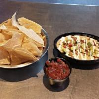 Loaded Queso · House queso, Angus beef, pico, hatch green chiles, avocado, sour cream and side of chips and...