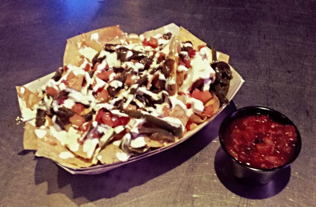 Nachos · Tortilla chips, queso, grilled jalapenos, diced tomato, sour cream and a side of salsa.