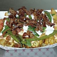 Queso Fries · House queso, griled jalapenos, bacon, diced tomato and sour cream.