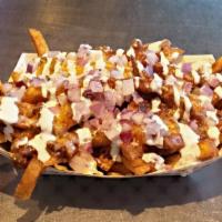 Chili Cheese Fries · Chili, cheddar cheese, red onion and sour cream.