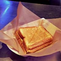 Grilled Cheese · Melted American cheese on Texas toast.