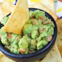 Guacamole Regional · Chunky, fresh avocados cut in pieces and topped with pico de gallo. Served with golden flour...
