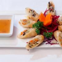 Crispy Rolls · Glass noodles, black mushrooms, cabbage, taro and carrots, served with plum sauce.