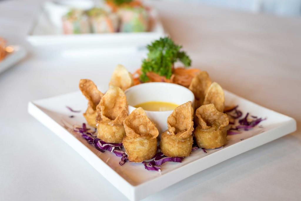 Crab Rangoon Rings · Crab meat and cream cheese wrapped in wonton skins, served with honey mustard.