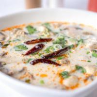Tom Kha Soup · Spicy coconut soup with mushrooms, seasoned with lemongrass, kaffir lime leaves, galangal, l...