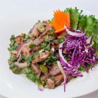 Roasted Duck Salad · Diced roasted duck seasoned with Thai herbs and chili in lime dressing.
