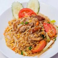 Roasted Duck Fried Rice · Eggs, carrots, peas, onions, scallions and tomatoes.