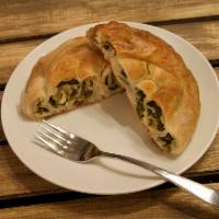 Spinach Börek · Flaky, delicate hand made dough. Filled with fresh spinach and Feta cheese.