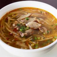 15. Duck Noodle Soup · Deep and fragrant broth soup from duck and dried bamboo. Served with vermicelli noodles and ...