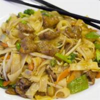 21. Chow Fun Noodle · Pan-fried smoked soft flat noodles topped with bean sprouts, carrots, broccoli, snow peas, z...